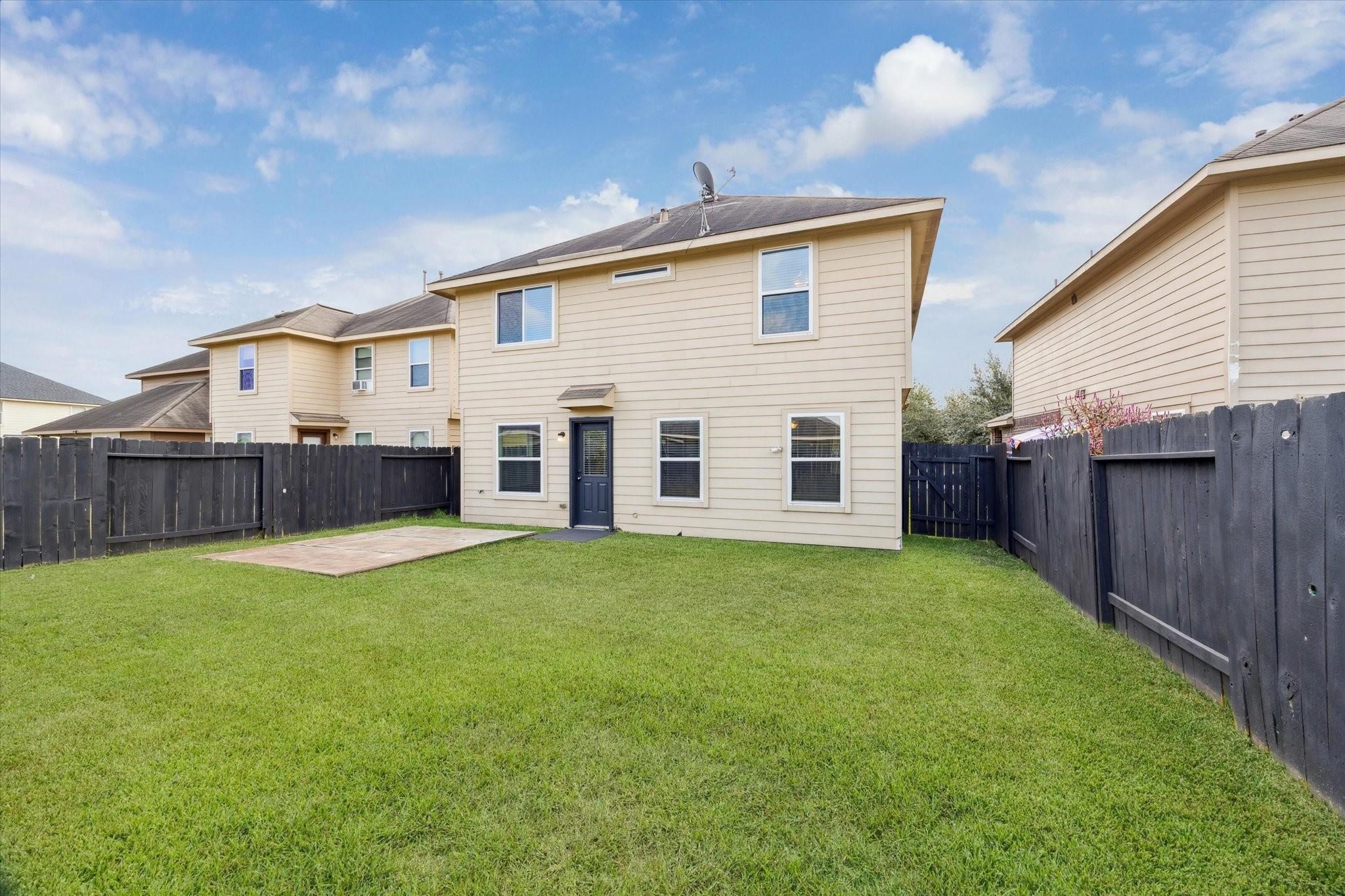 11718 Red Hummingbird Drive Houston, TX 77047 - Photo 13 of 13 a view of a backyard with wooden fence