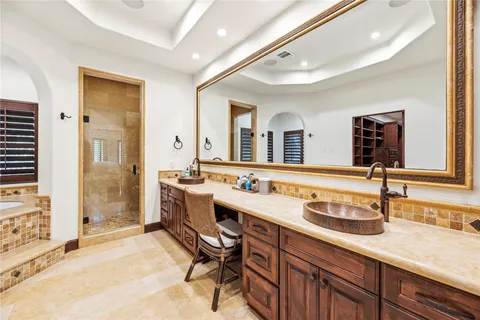 a bathroom with a sink double vanity and a mirror
