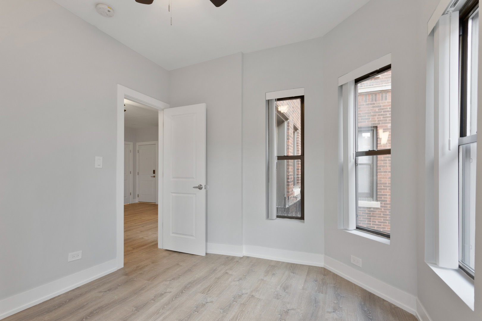 1651 West Jonquil Terrace, Unit 8 Chicago, IL 60626 - Photo 11 of 17 an empty room with windows and closet