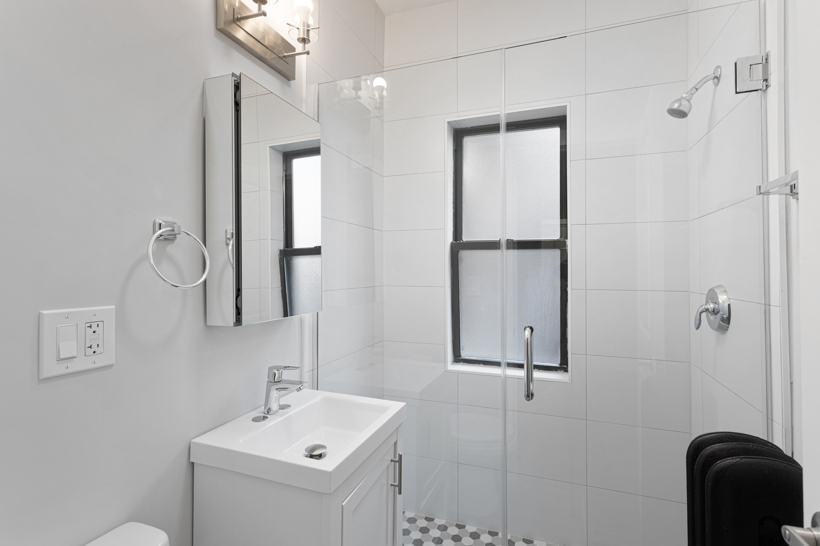 1651 West Jonquil Terrace, Unit 8 Chicago, IL 60626 - Photo 12 of 17 a bathroom with a sink mirror and vanity