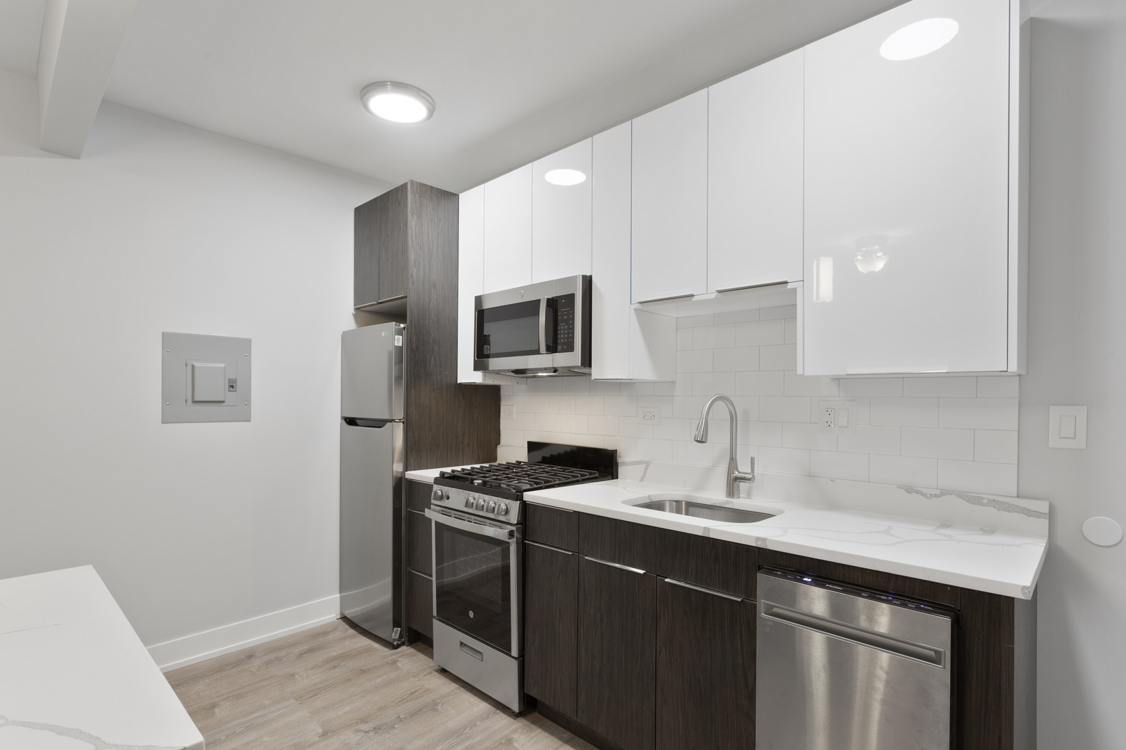 1651 West Jonquil Terrace, Unit 8 Chicago, IL 60626 - Photo 5 of 17 a kitchen with a sink appliances and cabinets