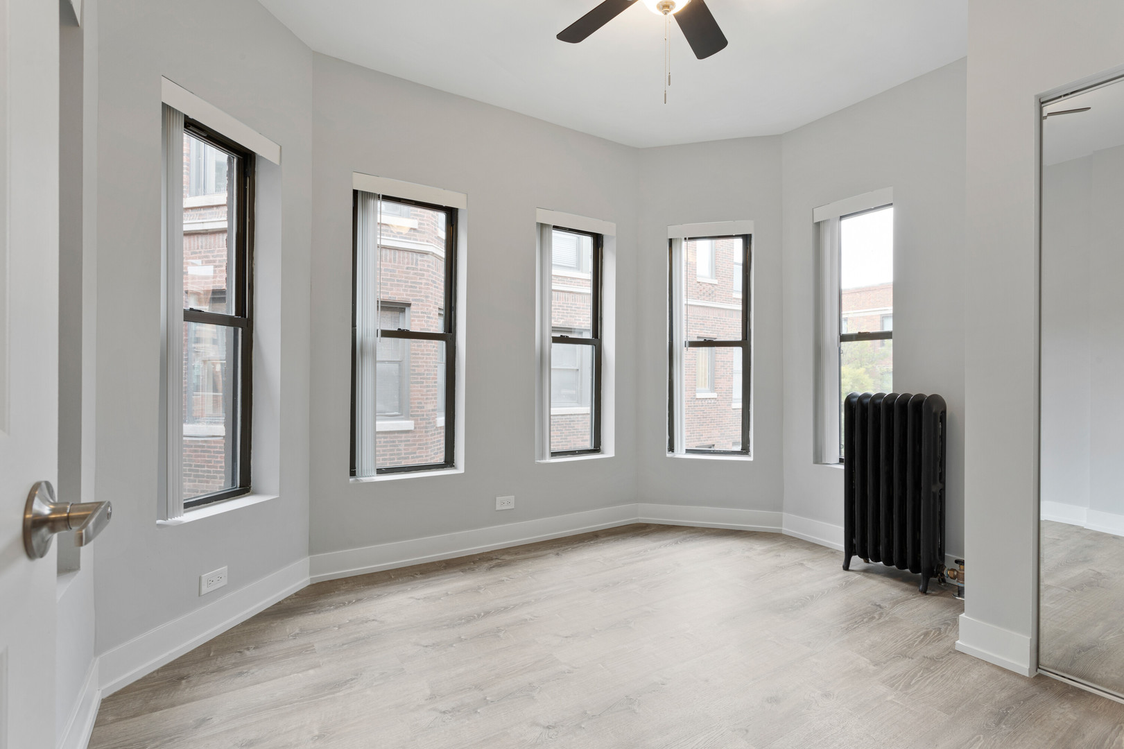 1651 West Jonquil Terrace, Unit 8 Chicago, IL 60626 - Photo 8 of 17 an empty room with windows and closet