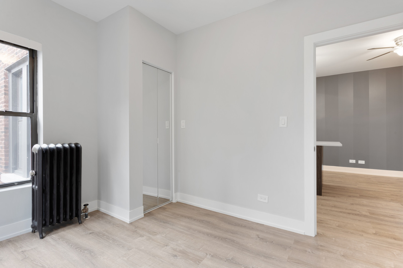 1651 West Jonquil Terrace, Unit 8 Chicago, IL 60626 - Photo 10 of 17 an empty room with wooden floor and windows