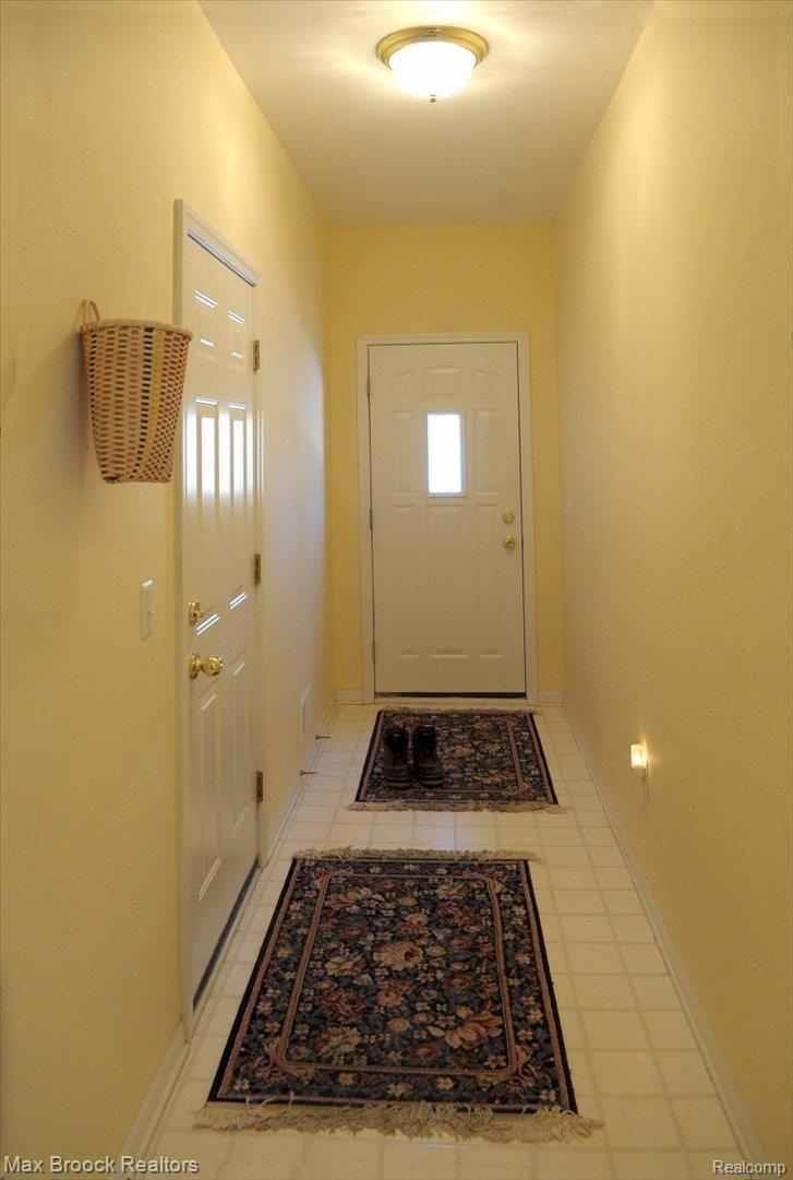 60622 Balmoral Way Rochester, MI 48306 - Photo 14 of 25 Hall to 3-Car Garage & Side Door