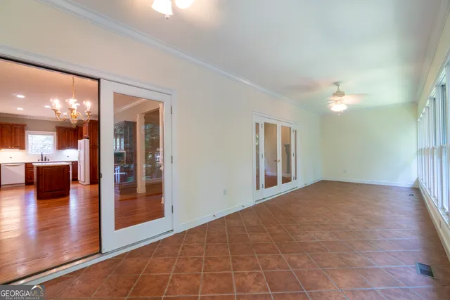 a spacious bathroom with a tub sink and mirror