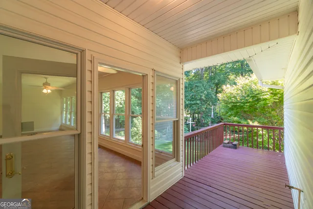 a bathroom with bathtub and window