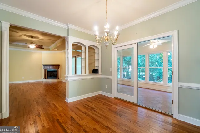 a utility room with cabinets washer and dryer