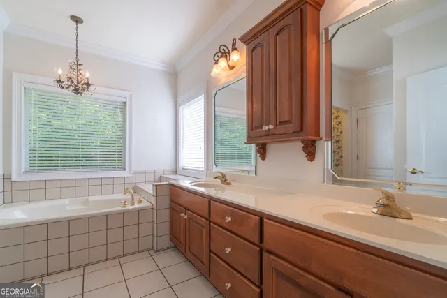 a view of a house with backyard and a tree