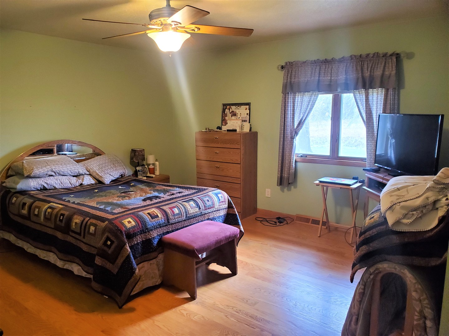 8776 Wolf Road Kingston, IL 60145 - Photo 13 of 35 a bedroom with a bed and a chandelier