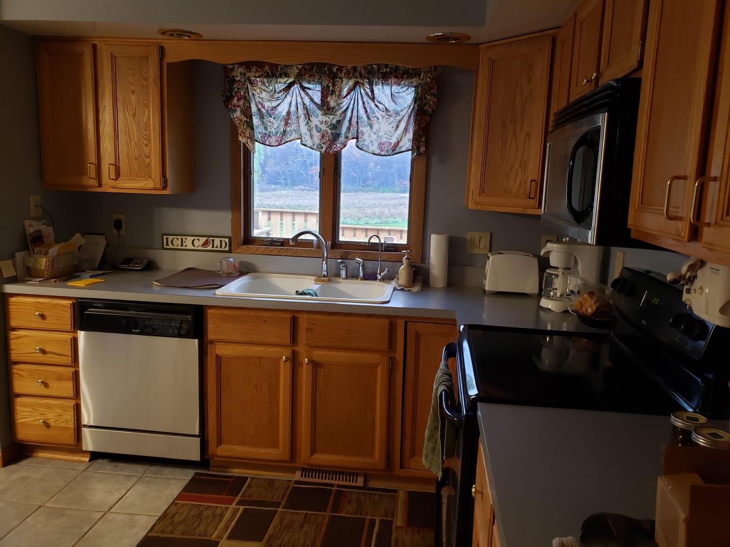 8776 Wolf Road Kingston, IL 60145 - Photo 18 of 35 a kitchen with stainless steel appliances a sink stove and cabinets