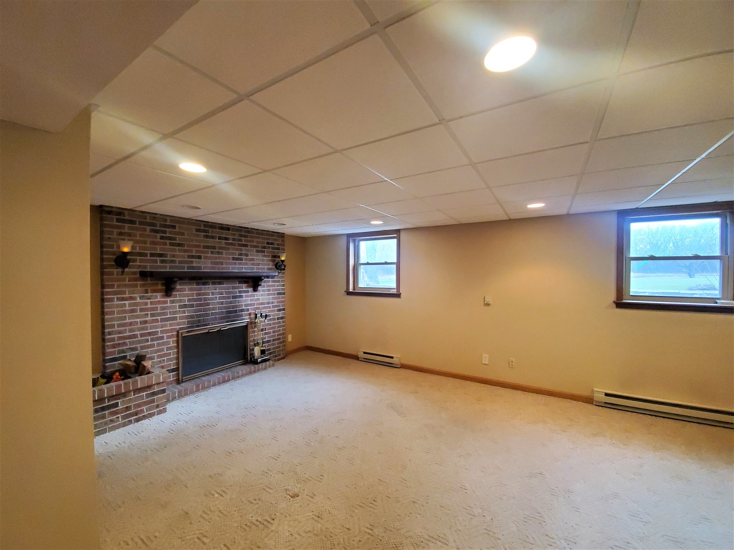 8776 Wolf Road Kingston, IL 60145 - Photo 23 of 35 a view of an empty room with a fireplace