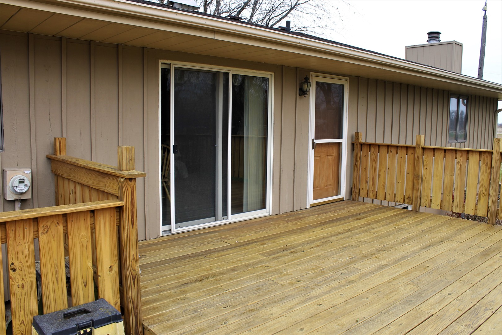 8776 Wolf Road Kingston, IL 60145 - Photo 32 of 35 a view of an empty room with wooden floor and a window