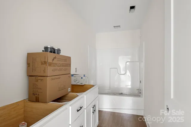 a kitchen with a refrigerator and washer