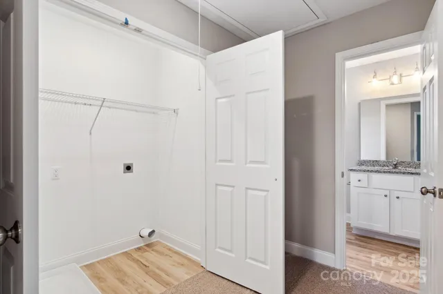 a bathroom with a shower and a sink