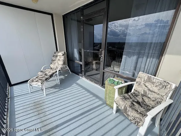 a living room with wooden floor furniture and a fireplace