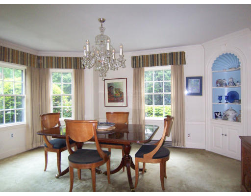 19 Hilltop Road Brookline, MA 02467 - Photo 8 of 30 a dining room with furniture a chandelier and wooden floor