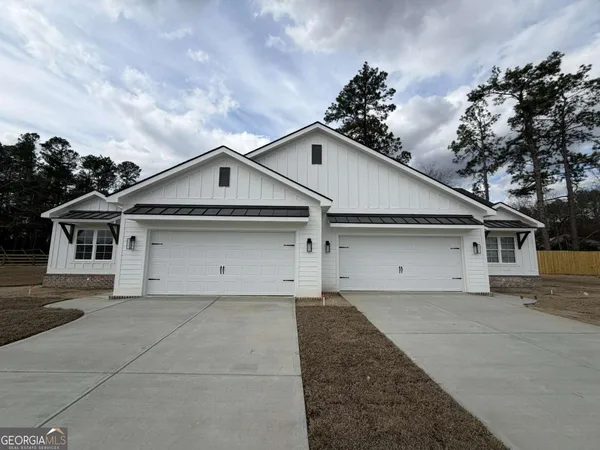 a front view of a house with a garage