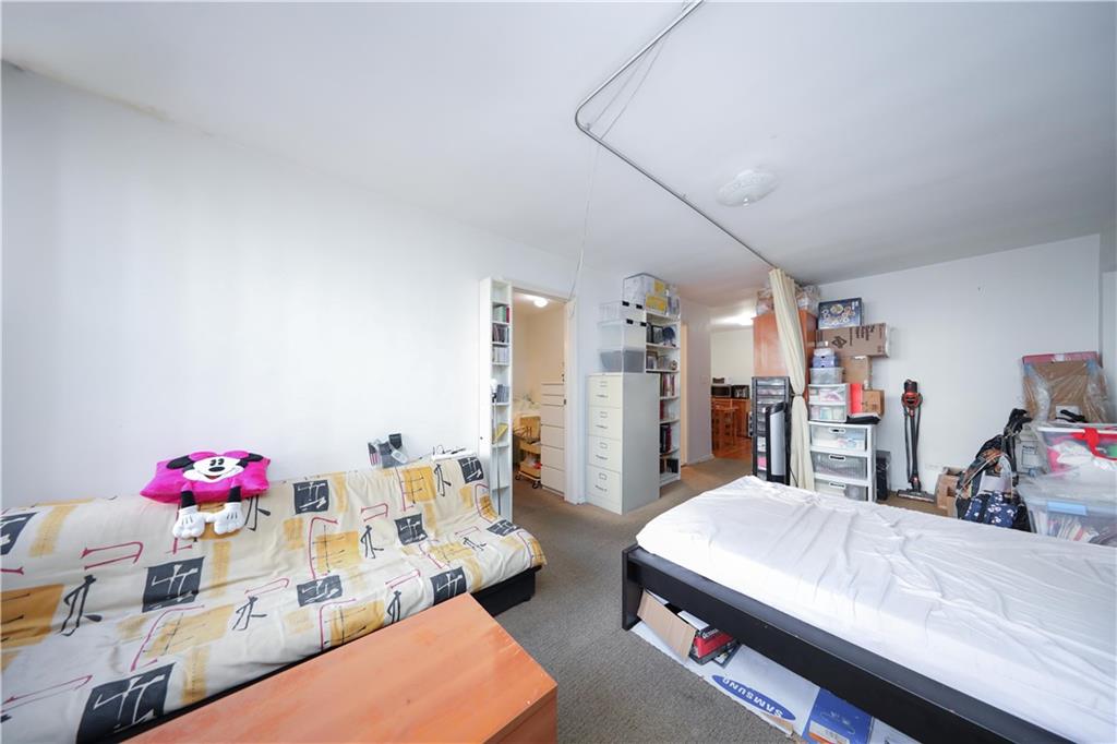 1625 Emmons Avenue, Unit 4N Brooklyn, NY 11235 - Photo 12 of 32 a very nice looking room with a large bed furniture and a kitchen view