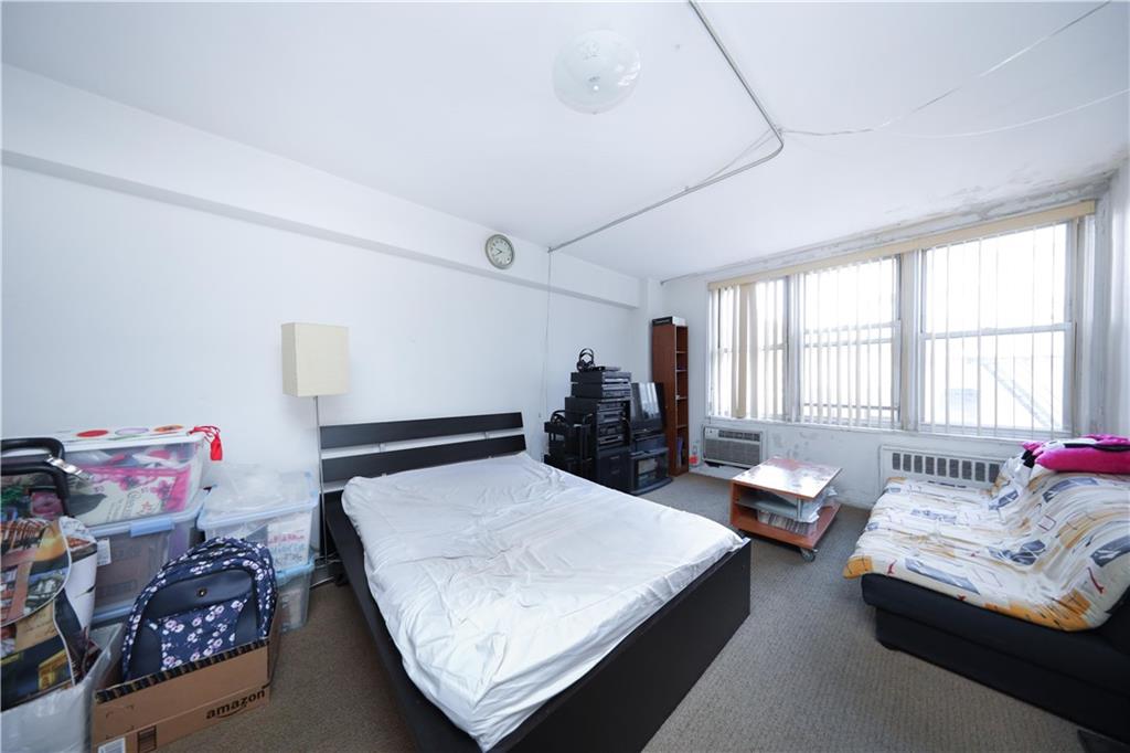 1625 Emmons Avenue, Unit 4N Brooklyn, NY 11235 - Photo 14 of 32 a bedroom with a bed and window