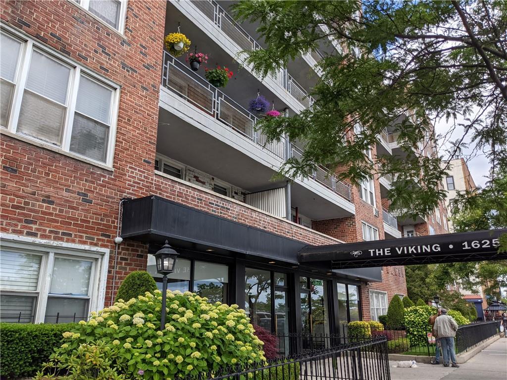 1625 Emmons Avenue, Unit 4N Brooklyn, NY 11235 - Photo 31 of 32 a front view of a building with garden