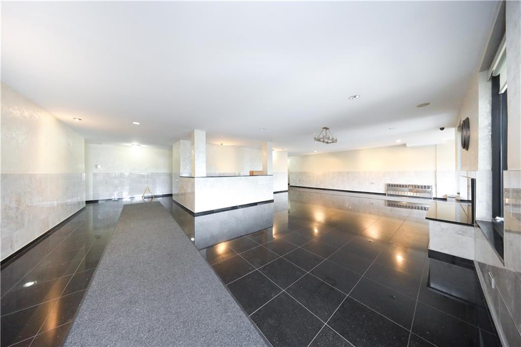 1625 Emmons Avenue, Unit 4N Brooklyn, NY 11235 - Photo 4 of 32 a view of a kitchen with a sink and cabinets
