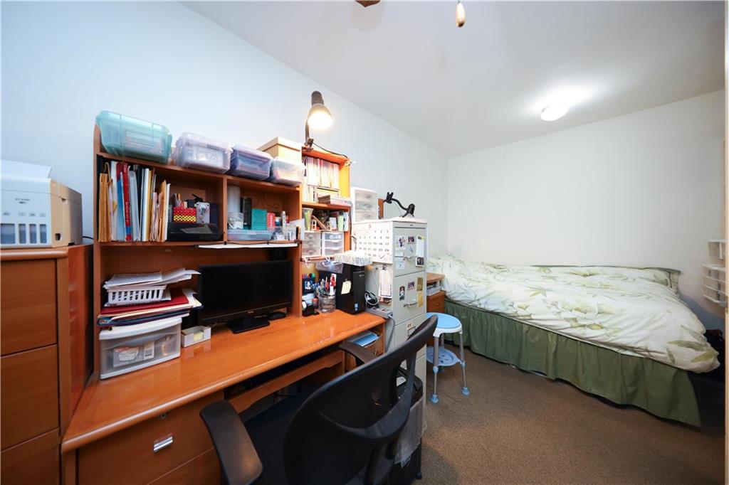 1625 Emmons Avenue, Unit 4N Brooklyn, NY 11235 - Photo 10 of 32 a room with furniture cabinets and book shelf