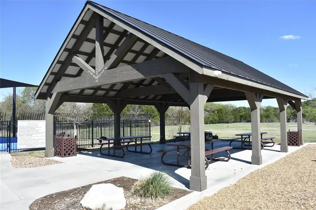 a view of swimming pool with a patio