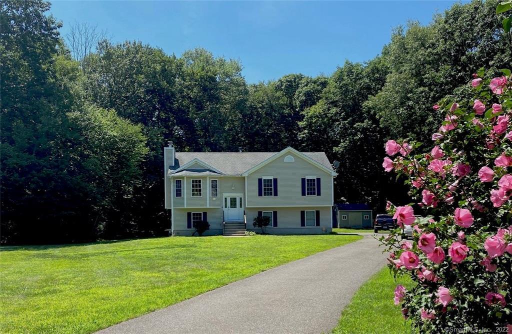 430 Jones Road Naugatuck, CT 06770 - Photo 1 of 1 a front view of a house with a garden