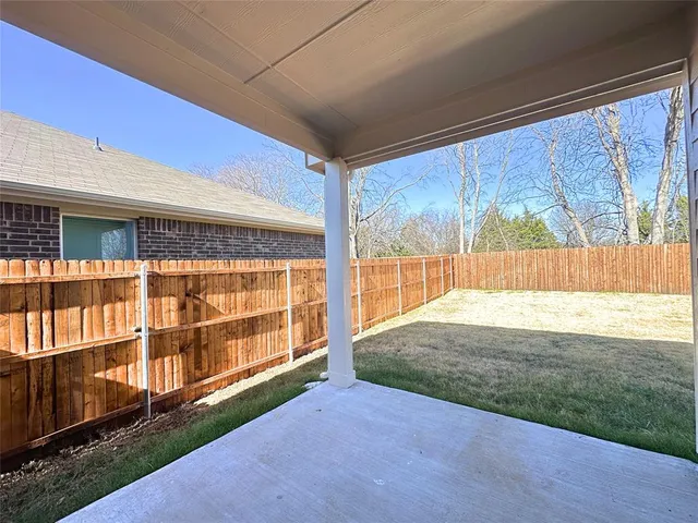 a view of backyard with large window