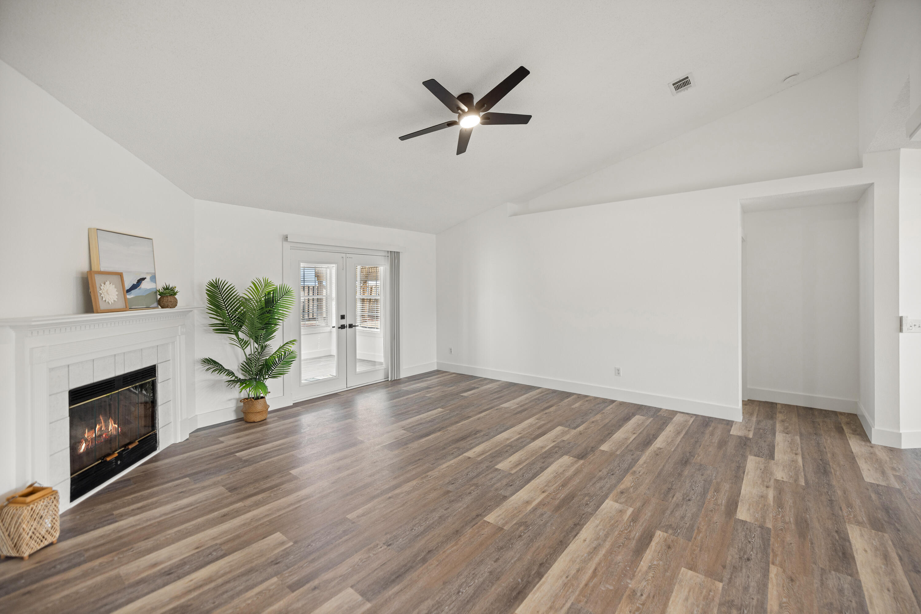 2001 Jessica Way Navarre, FL 32566 - Photo 13 of 73 a view of empty room with wooden floor and fireplace