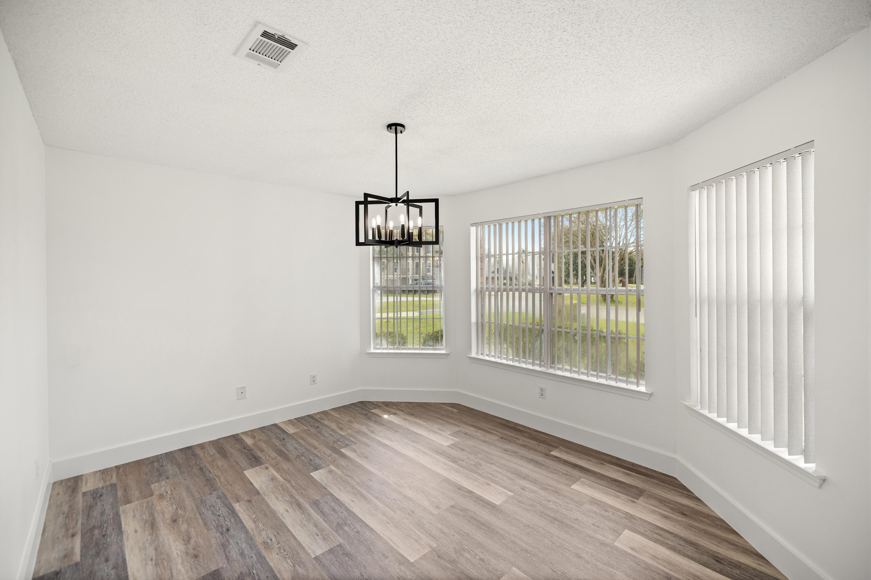 2001 Jessica Way Navarre, FL 32566 - Photo 23 of 73 wooden floor in an empty room with a window