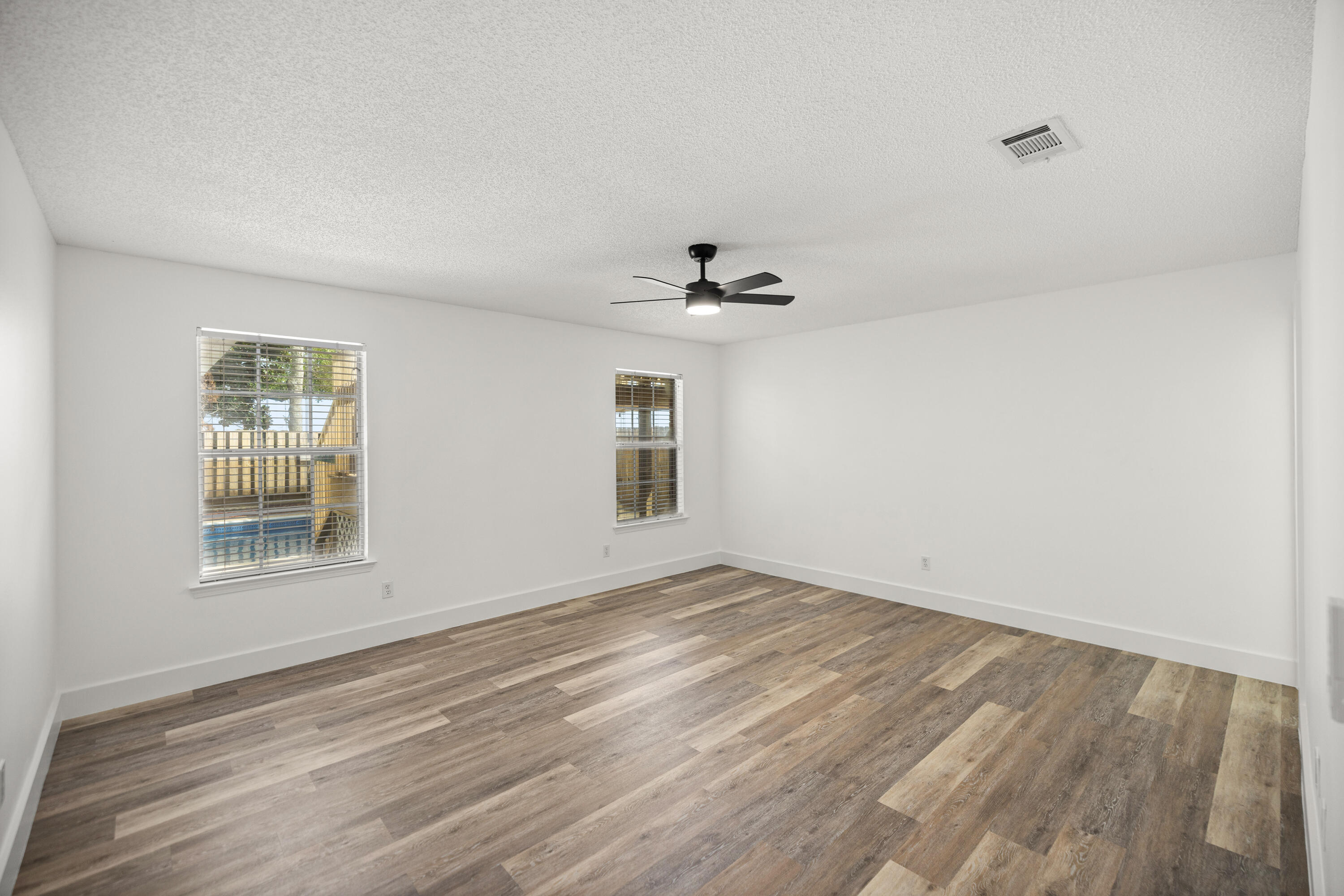 2001 Jessica Way Navarre, FL 32566 - Photo 26 of 73 wooden floor in an empty room with a window