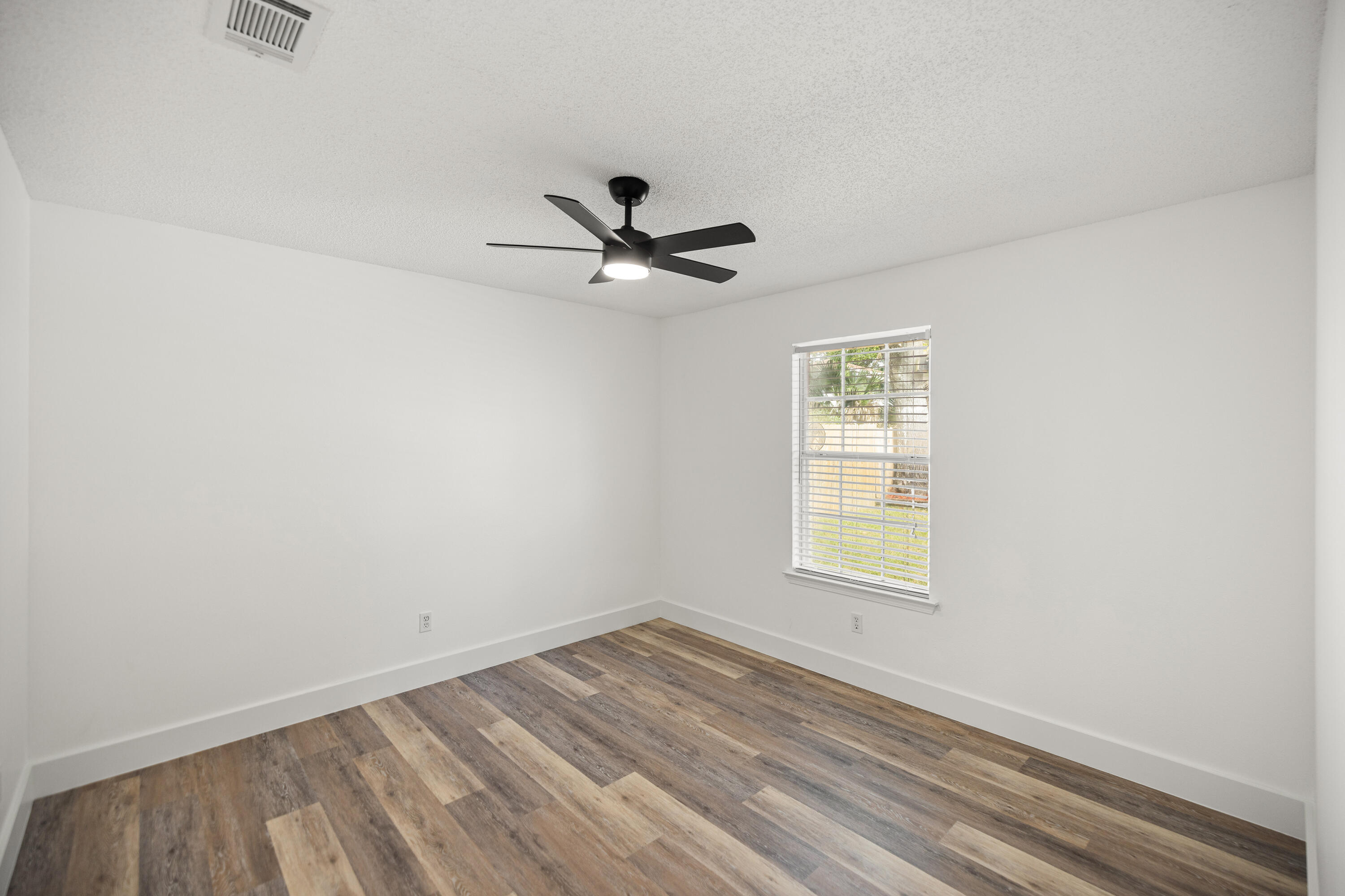 2001 Jessica Way Navarre, FL 32566 - Photo 37 of 73 an empty room with a window and a fan