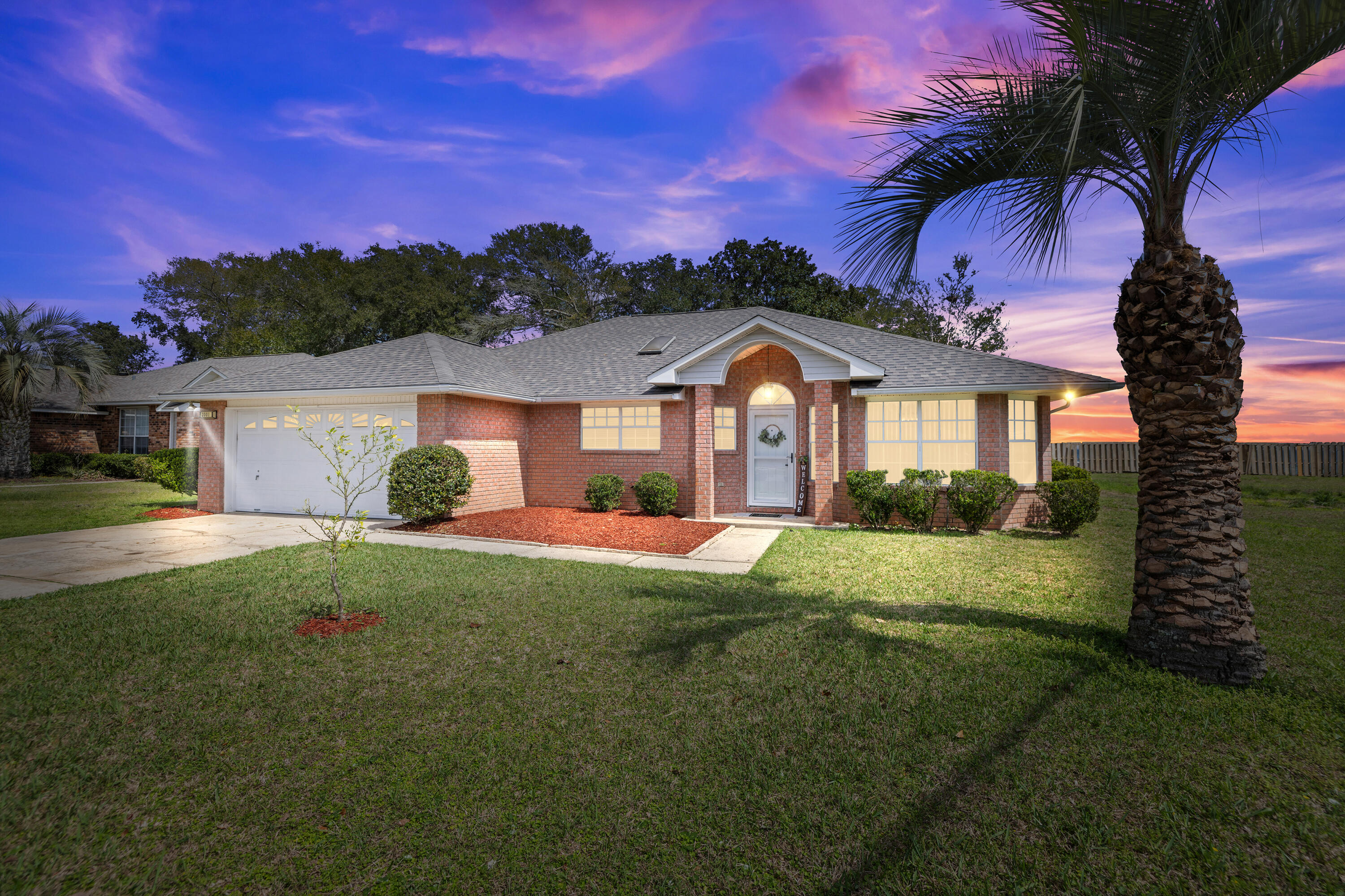 2001 Jessica Way Navarre, FL 32566 - Photo 4 of 73 a front view of a house with a yard and garage