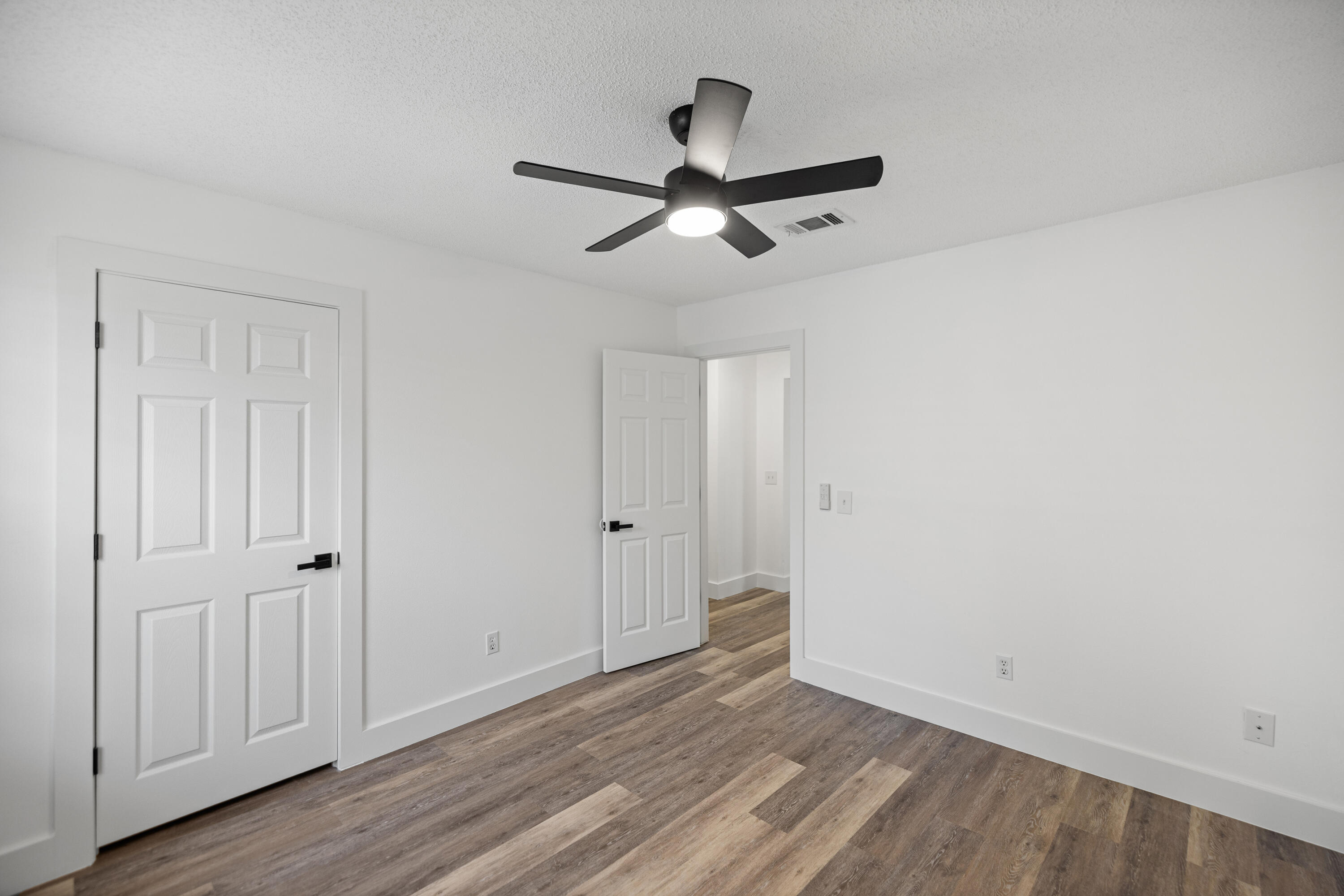 2001 Jessica Way Navarre, FL 32566 - Photo 42 of 73 a view of empty room with wooden floor