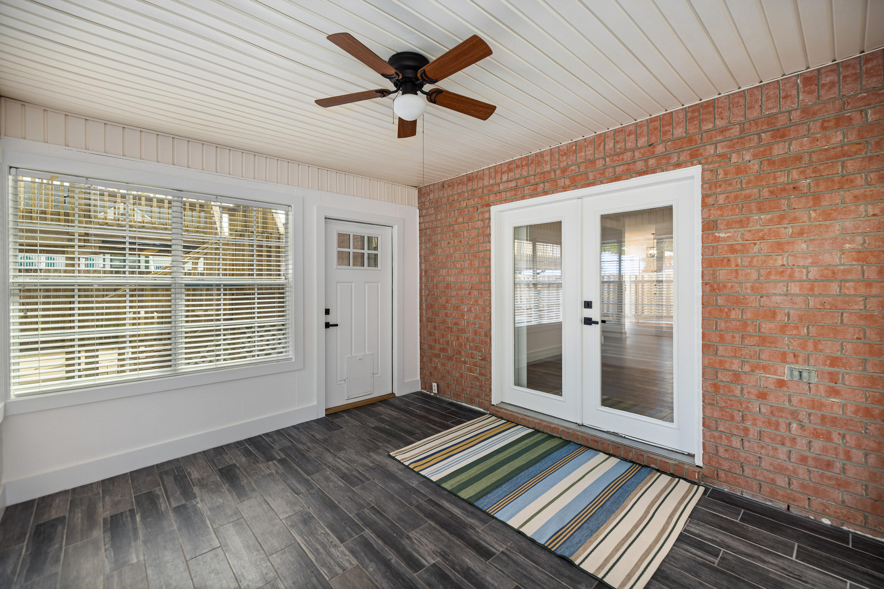 2001 Jessica Way Navarre, FL 32566 - Photo 44 of 73 a view of an empty room with a window and wooden floor