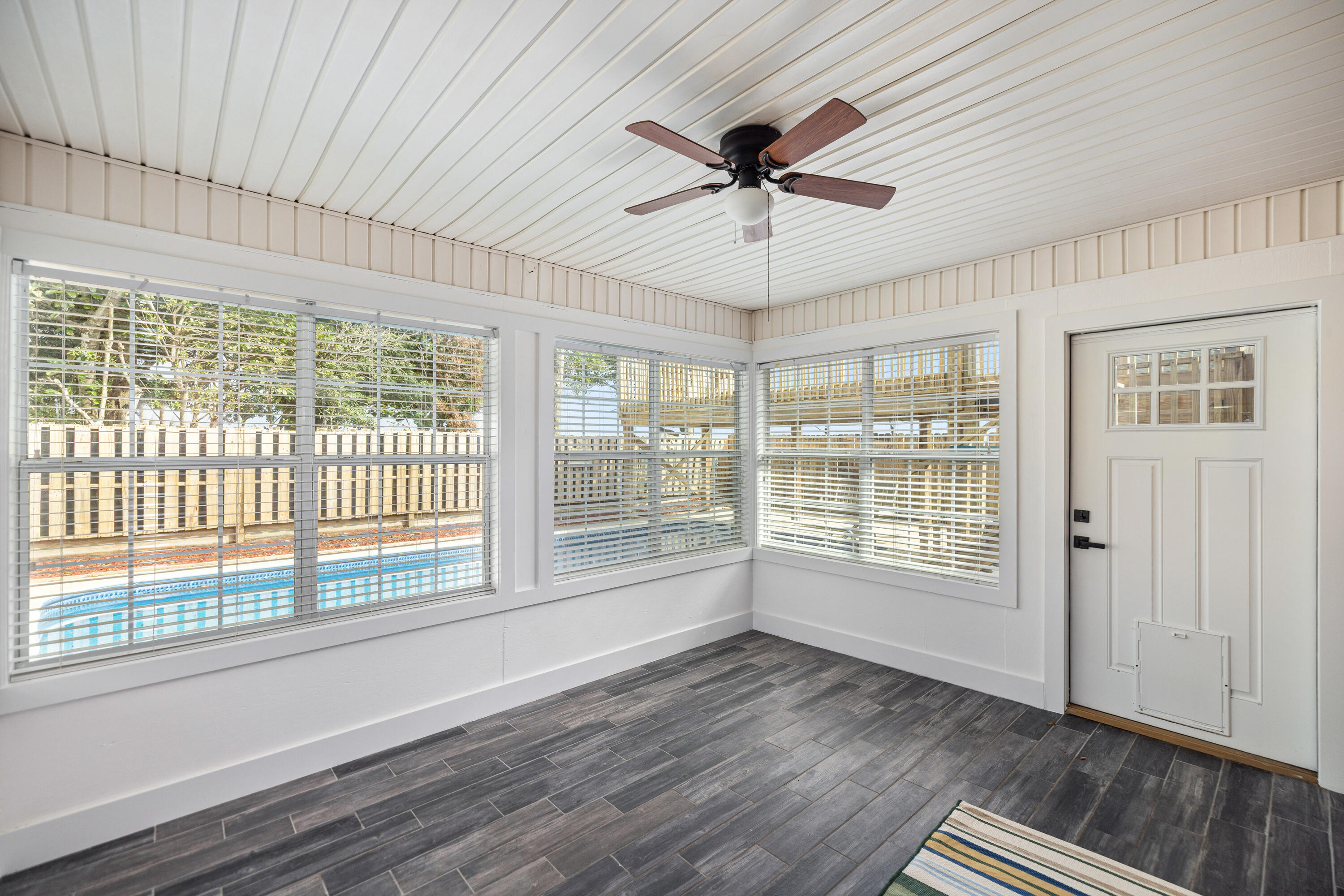 2001 Jessica Way Navarre, FL 32566 - Photo 45 of 73 a view of an empty room with a window and wooden floor