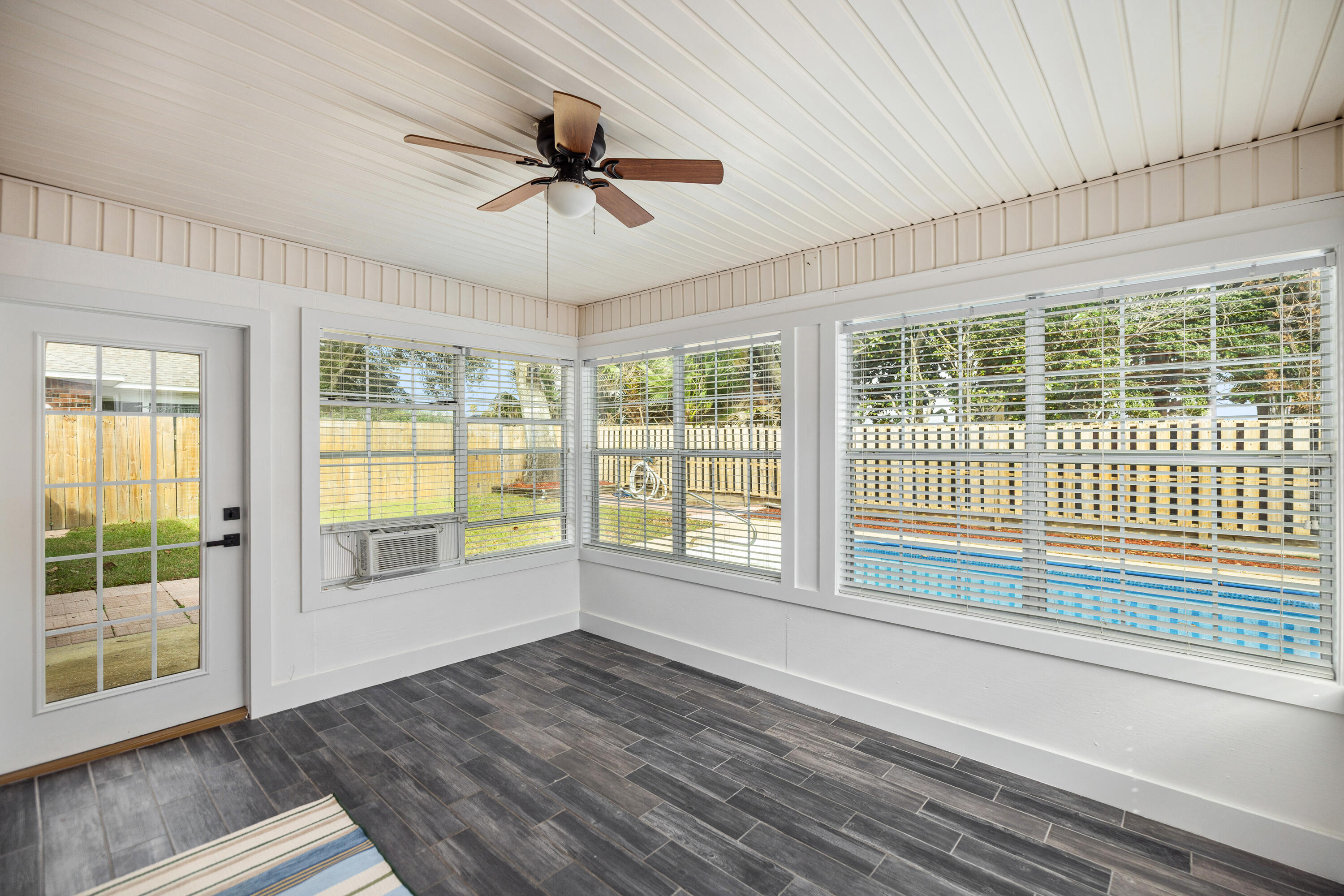 2001 Jessica Way Navarre, FL 32566 - Photo 46 of 73 a view of empty room with wooden floor and fan