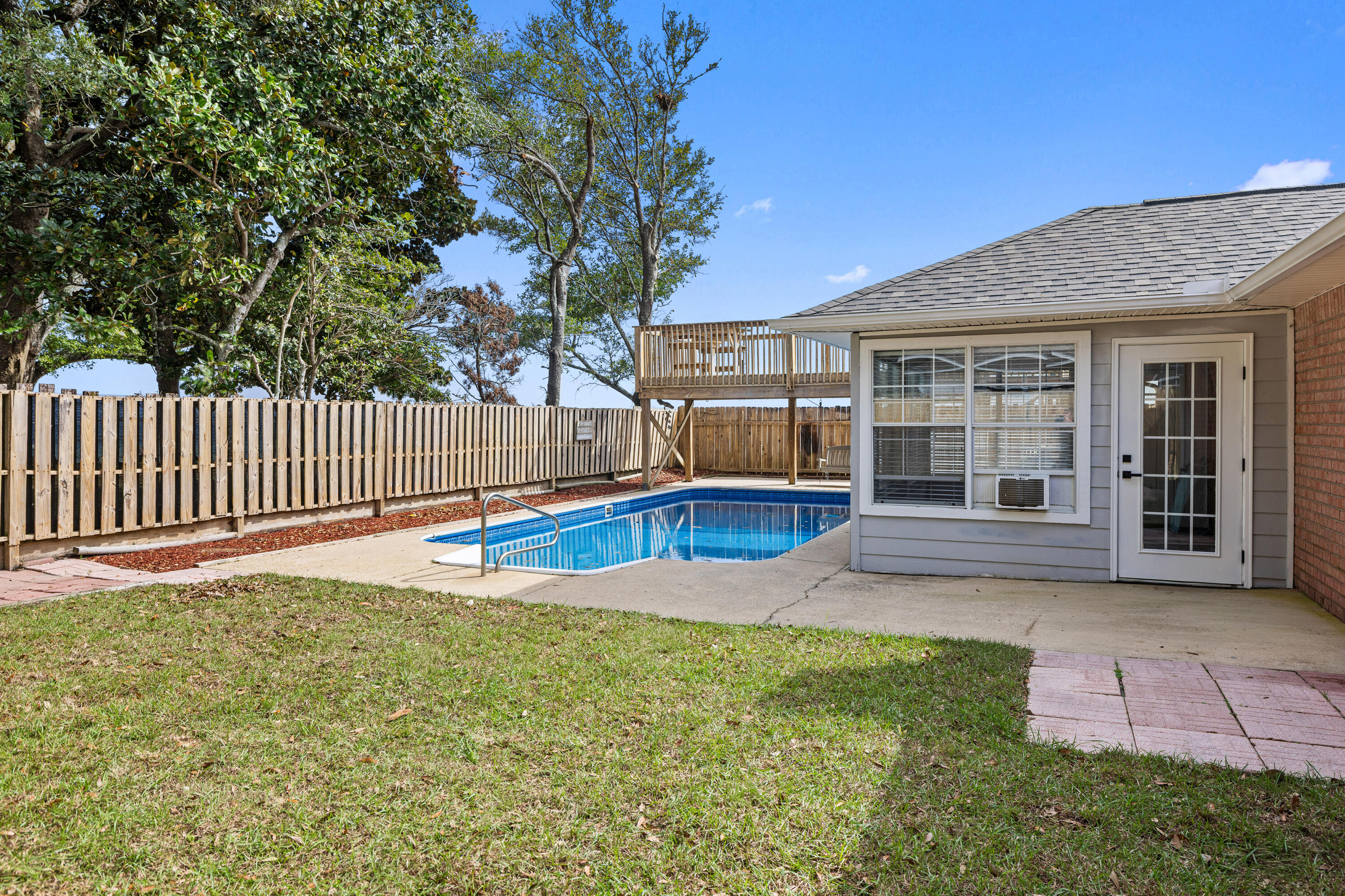 2001 Jessica Way Navarre, FL 32566 - Photo 51 of 73 a view of a house with backyard and a tree