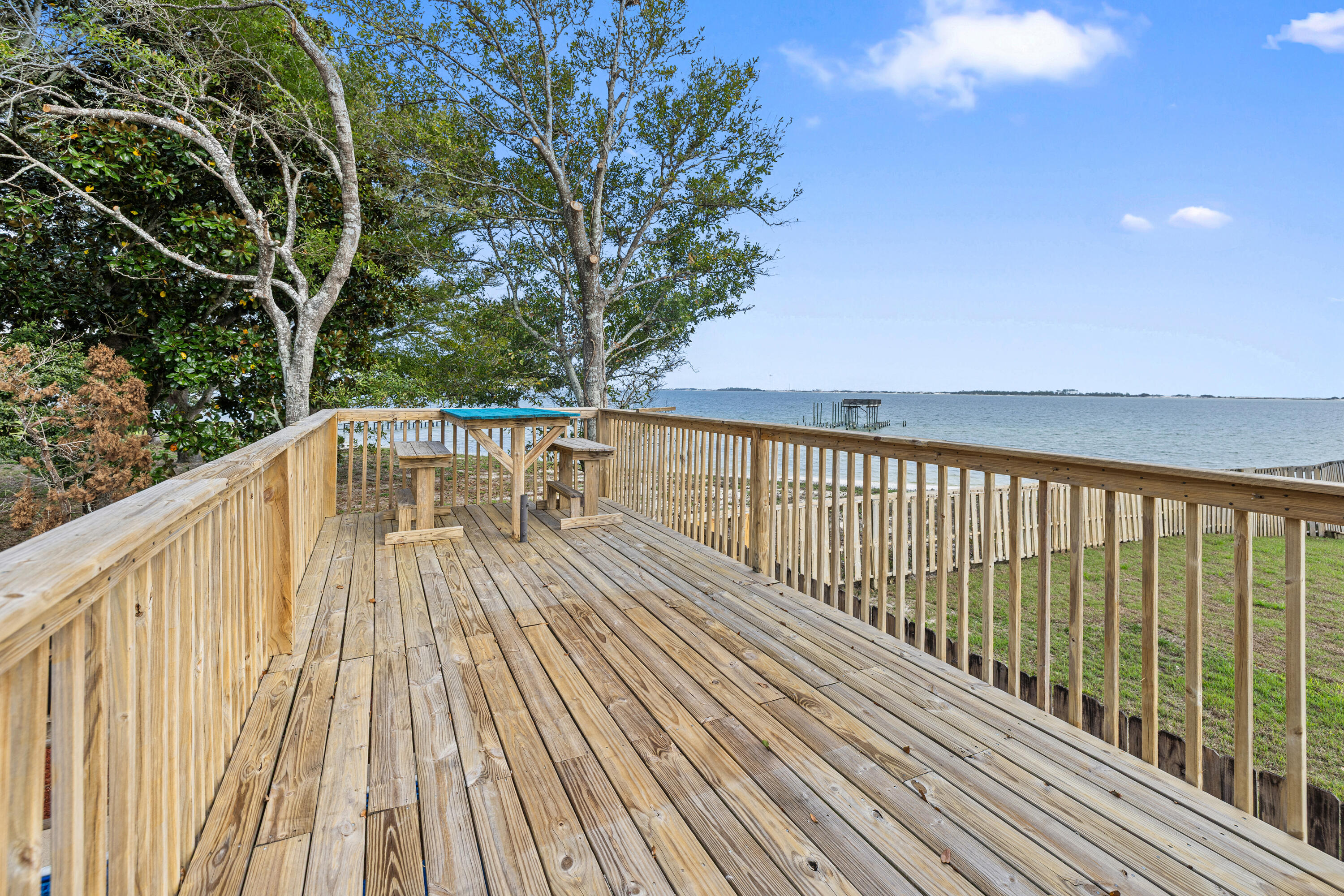 2001 Jessica Way Navarre, FL 32566 - Photo 55 of 73 a view of balcony with wooden floor and fence