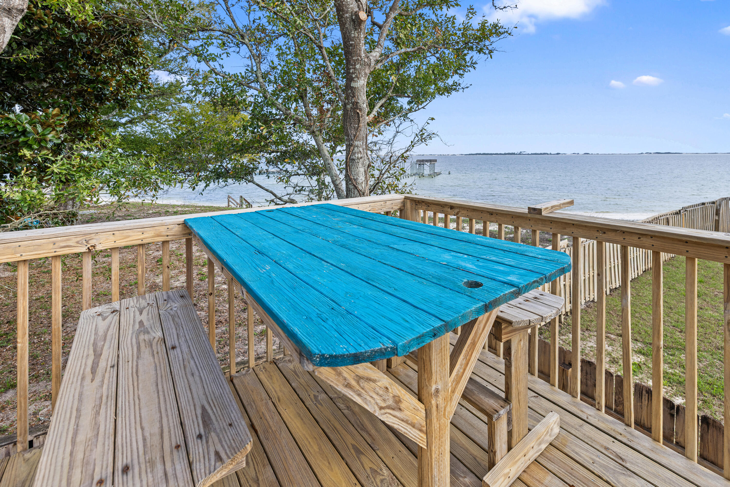 2001 Jessica Way Navarre, FL 32566 - Photo 56 of 73 a view of balcony with wooden floor and fence