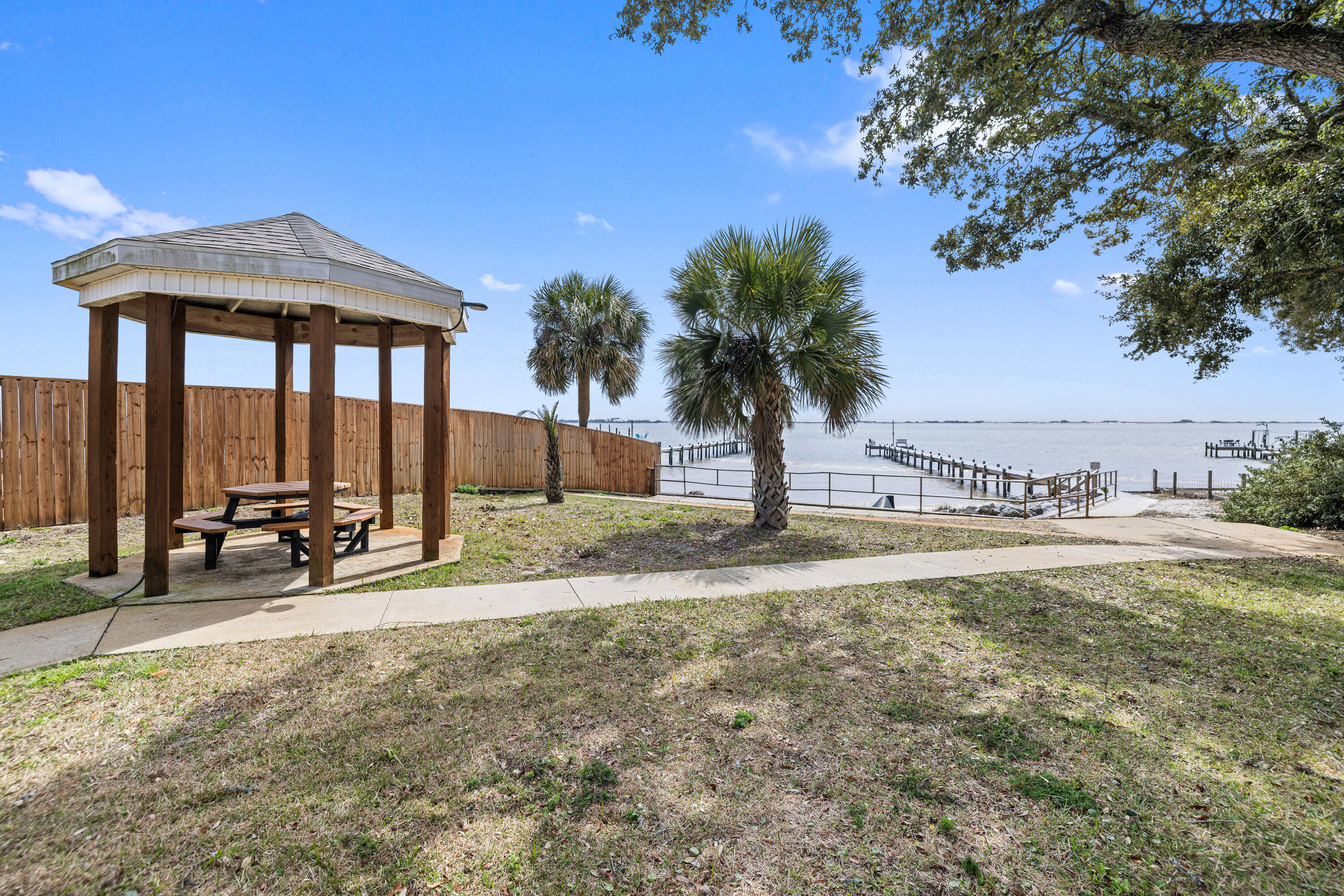 2001 Jessica Way Navarre, FL 32566 - Photo 66 of 73 a view of a house with backyard and sitting area