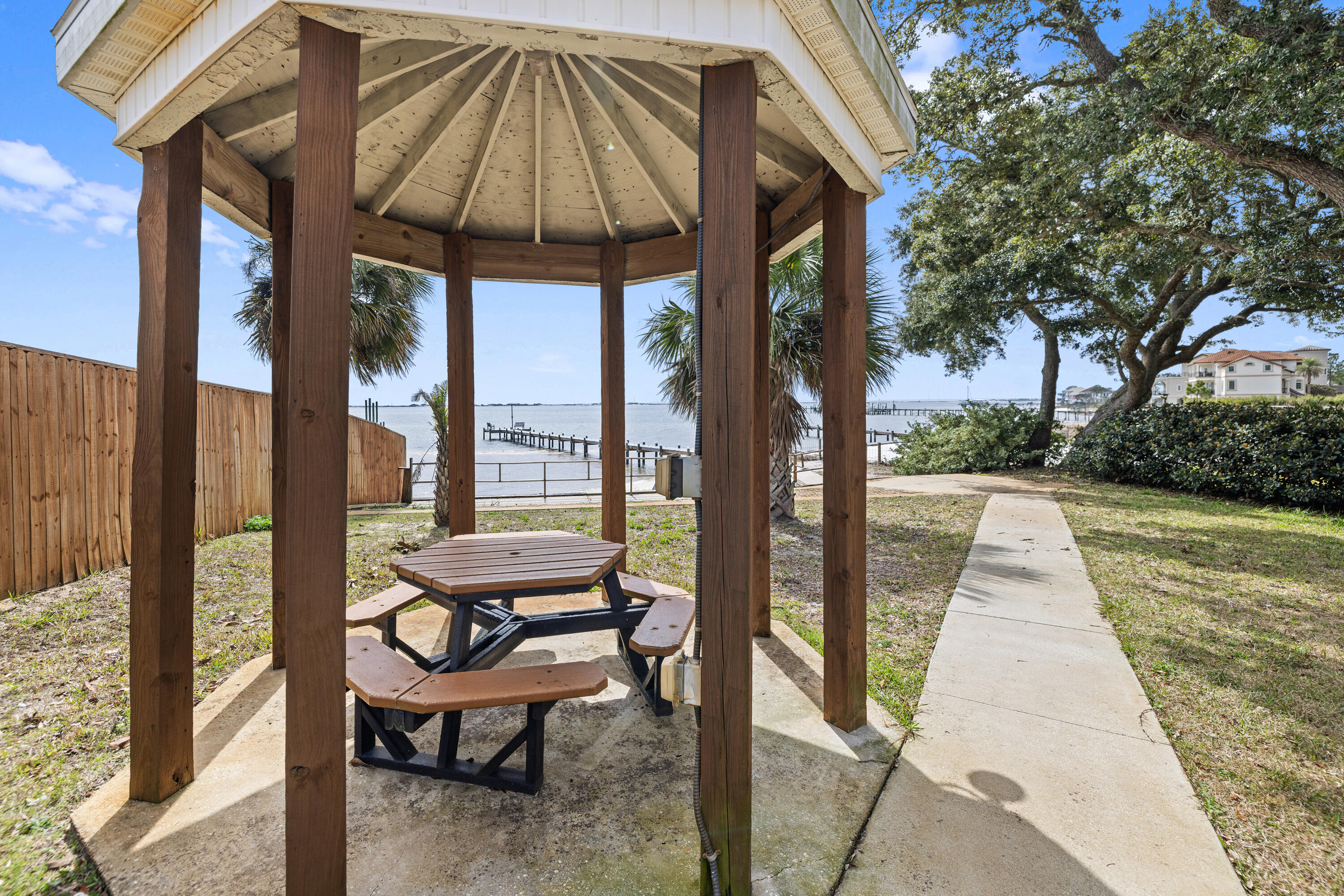 2001 Jessica Way Navarre, FL 32566 - Photo 73 of 73 a view of a two chairs and table in the patio with a small yard
