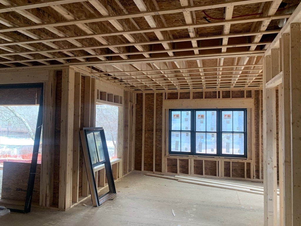 104 Eliot Street Natick, MA 01760 - Photo 4 of 7 a view of an empty room with a balcony