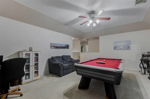 a bedroom with furniture and a chandelier