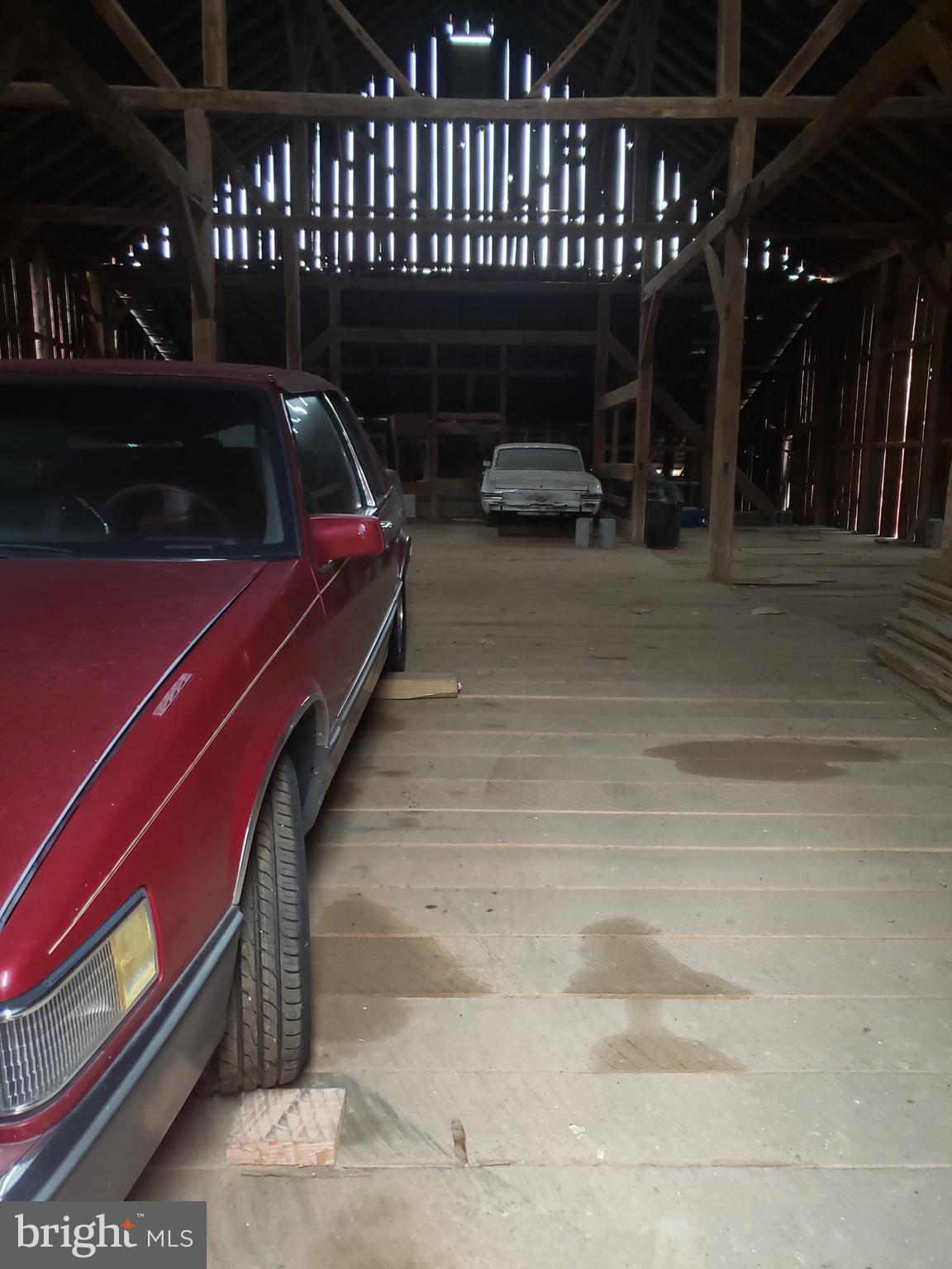 1718 Delp Road Whiteford, MD 21160 - Photo 19 of 30 a view of a patio with couches and table and chairs with wooden fence