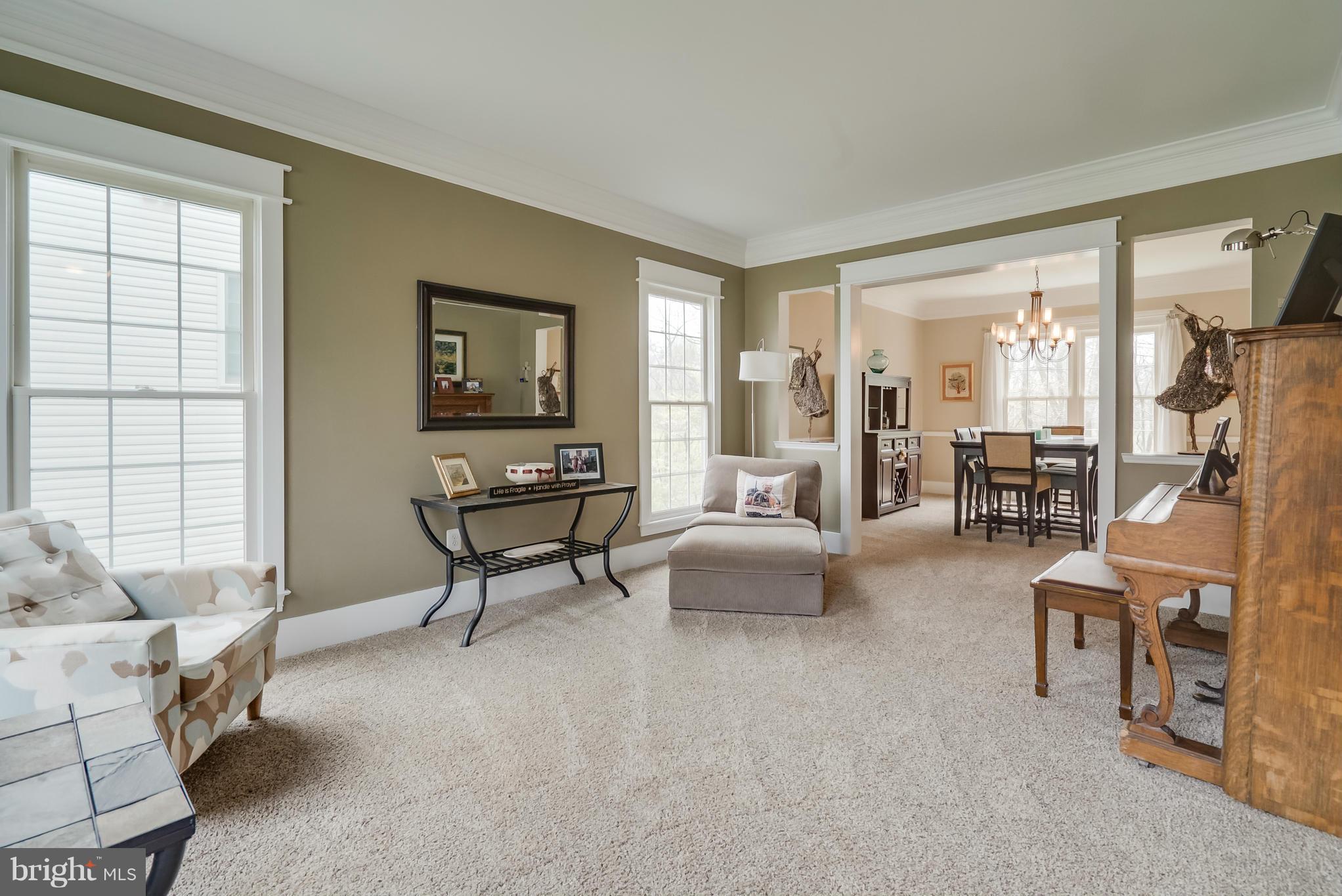 8759 Center Road Springfield, VA 22152 - Photo 11 of 30 a living room with furniture and a window