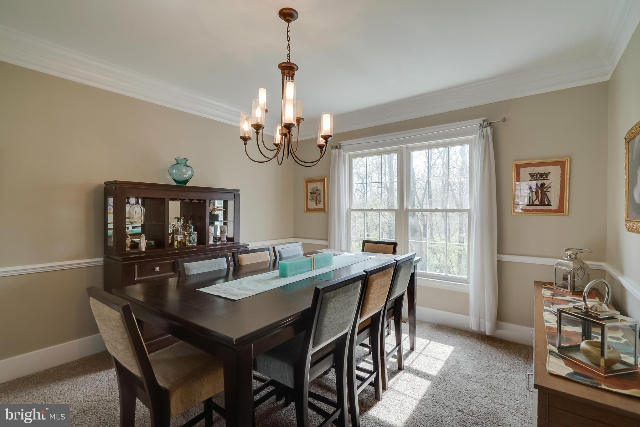 8759 Center Road Springfield, VA 22152 - Photo 13 of 30 a view of a dining room with furniture window and outside view