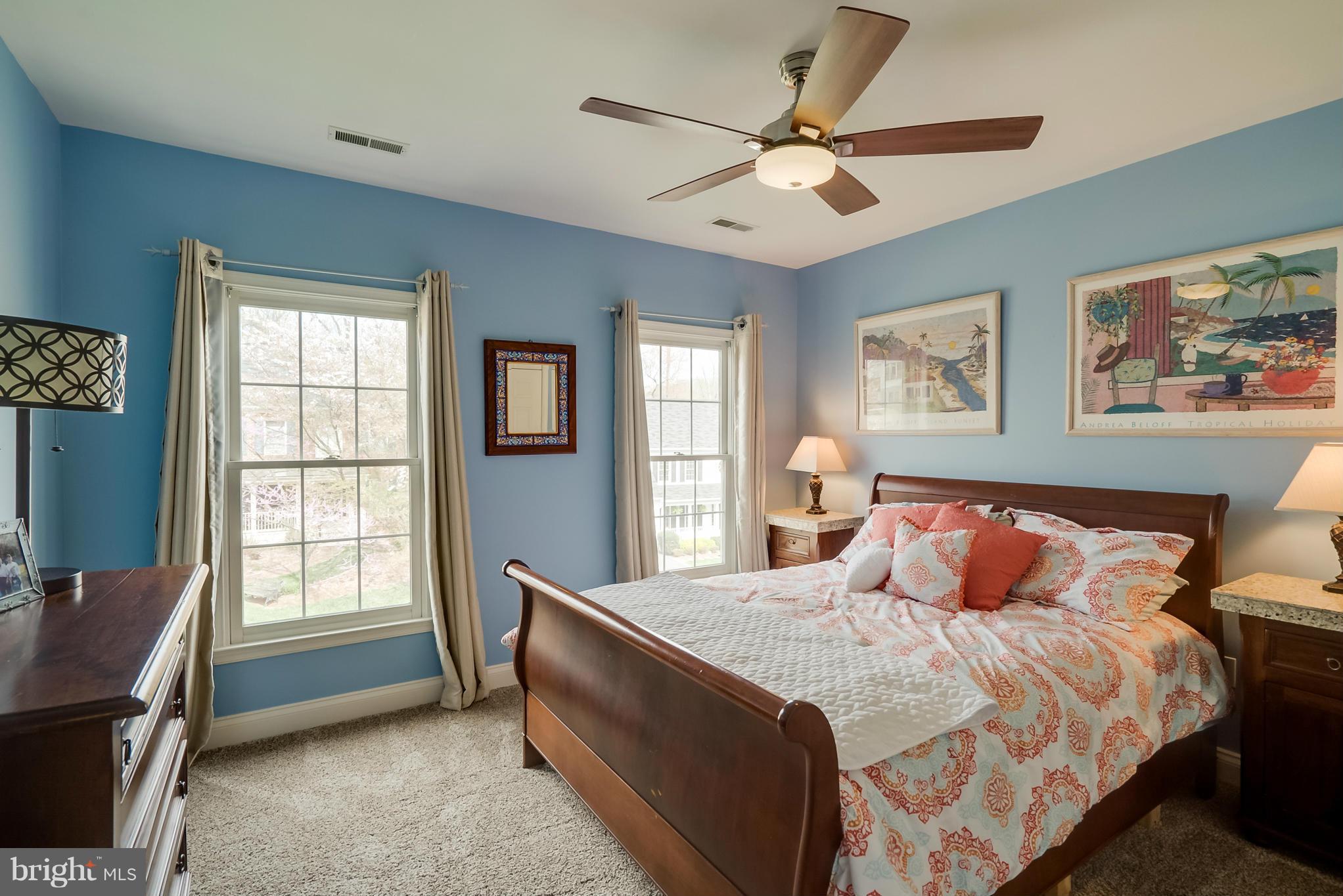 8759 Center Road Springfield, VA 22152 - Photo 20 of 30 a bedroom with a large bed and a window