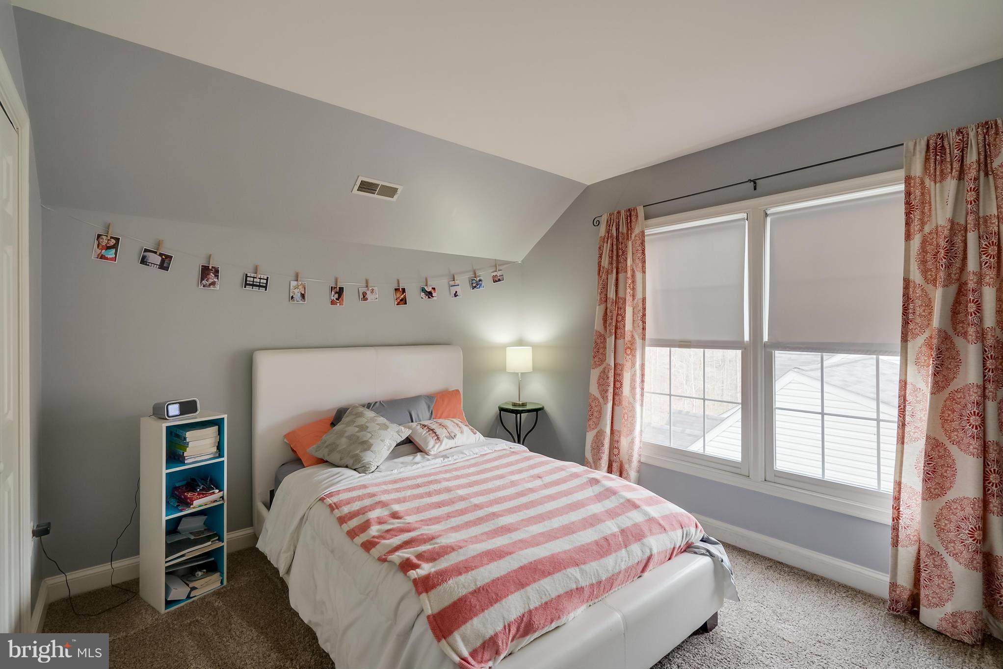 8759 Center Road Springfield, VA 22152 - Photo 26 of 30 a bedroom with a bed and a window